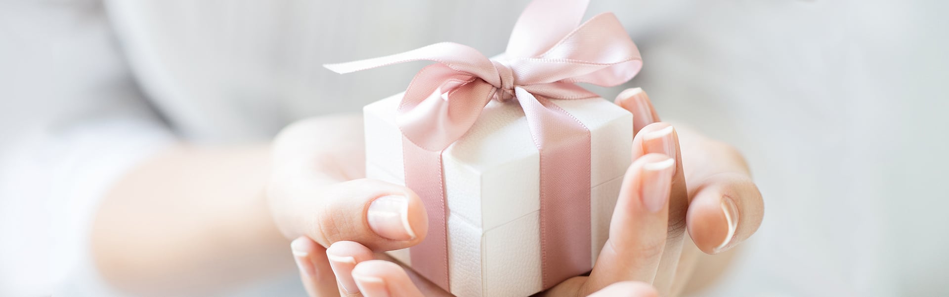 Gift box with pink ribbon